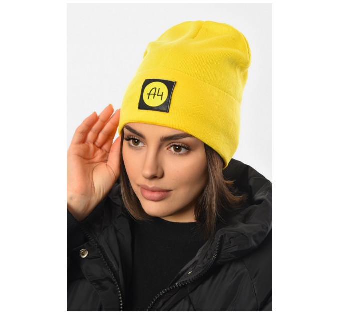 Шапка жіноча зимова на флісі однотонна жовтого кольору 193192L