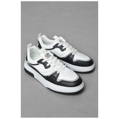 Кросівки чоловічі чорно-білого кольору на шнурівці 189894L