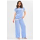 Костюм жіночий однотонний напівбатальний блакитного кольору 204935L